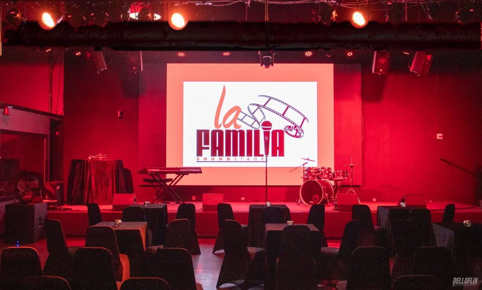 The La Familia main room, empty and lit in red before a scout