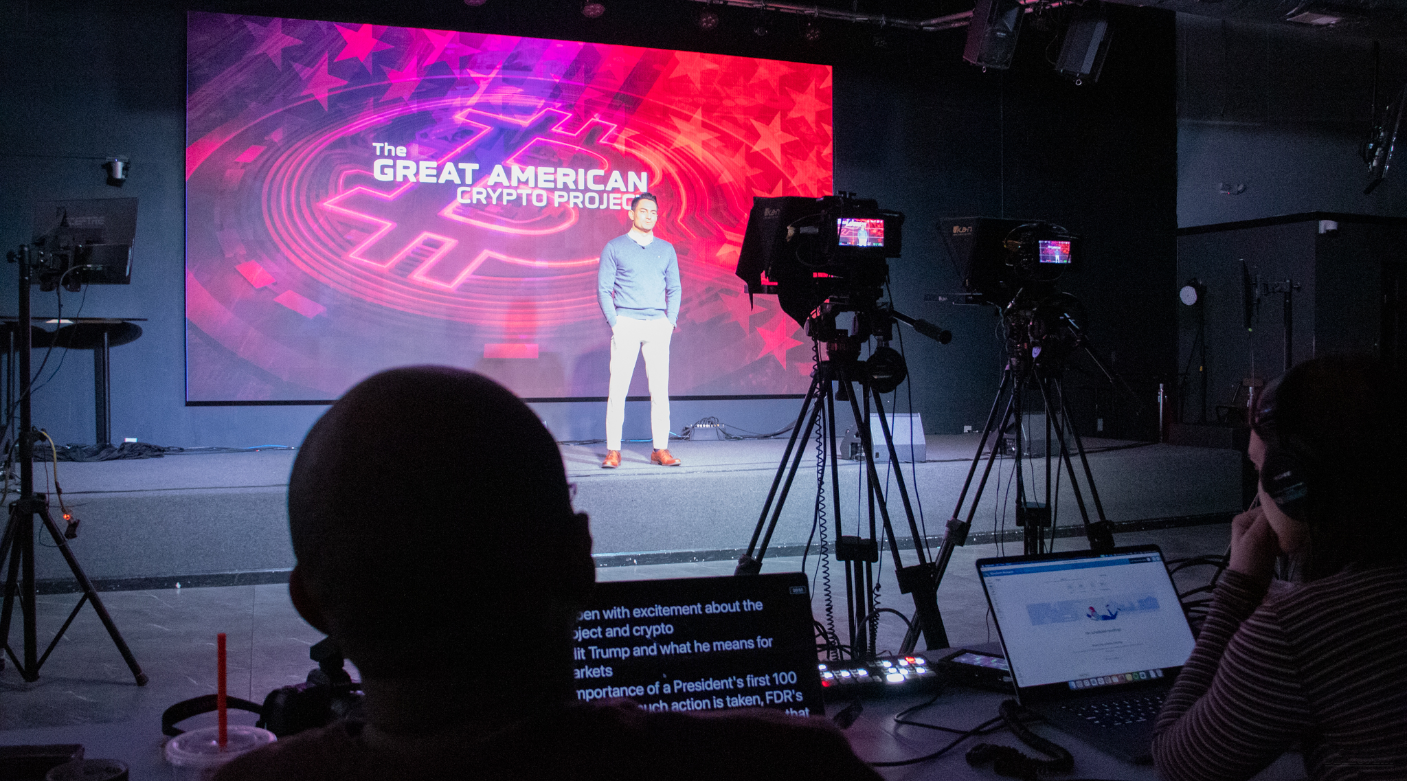 A camera operator and monitors during a live production