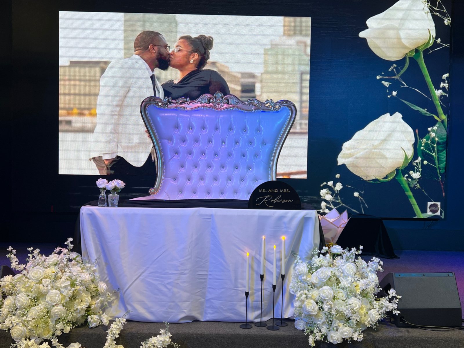A wedding sweetheart table with florals at La Familia